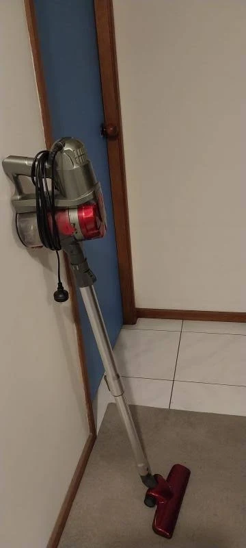 view of testing devanti corded handheld bagless vacuum cleaner budget stick vacuum australia unboxing package arrival several weeks to months